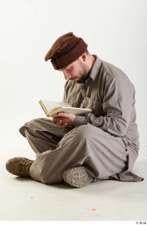 Luis Donovan Afgan Reading Book reading sitting whole body 0007.jpg